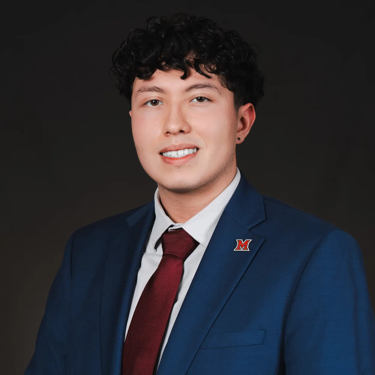 A professional headshot of Edgar Reyes-Rivera